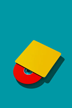 yellow cd reader with a red cd