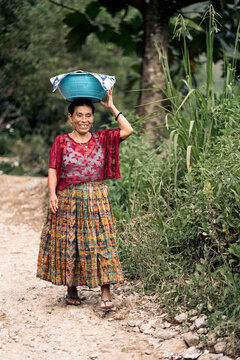 Mature guatemalan woman in traditional clothes walking