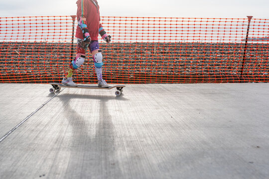 Faceless image of skateboarding girl