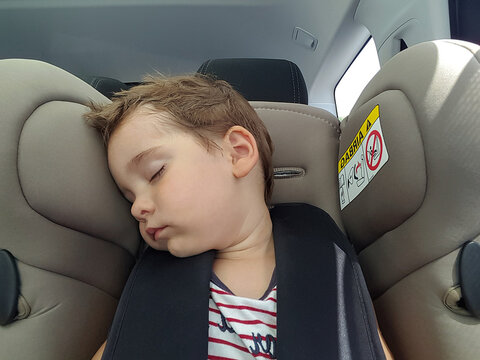 Sleeping child in the car seat