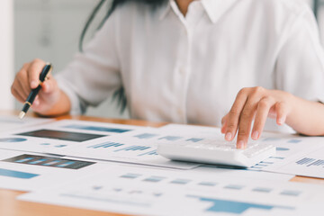 Business people or accountants are analyzing graphs on finance, investment, graph chart business strategy ideas, data analysis technology.