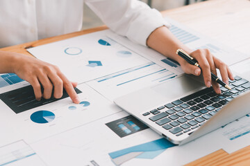 business and people concept, businesswoman with laptop computer and papers working at office