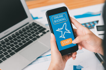 Woman Booking Flight Online with smartphone.