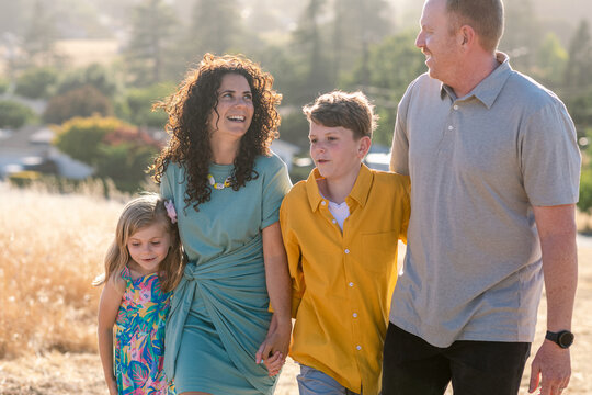 Happy Family By The Field