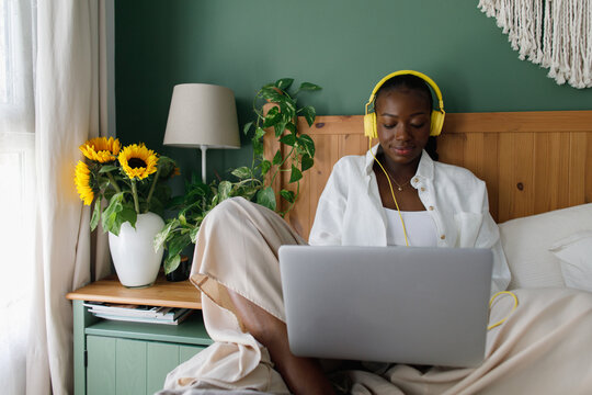 A young  black woman using a laptop computer
