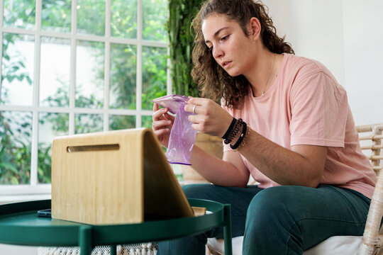 Teenager testing female condom