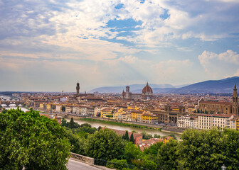 Fototapeta na wymiar A view from Piazzale de Michelangelo on Florence city on a cloudy day