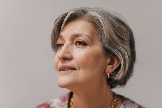 Senior woman beauty portrait gray background