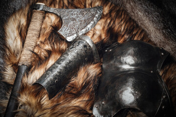 Shot of scandinavian armored suit and axe on fur