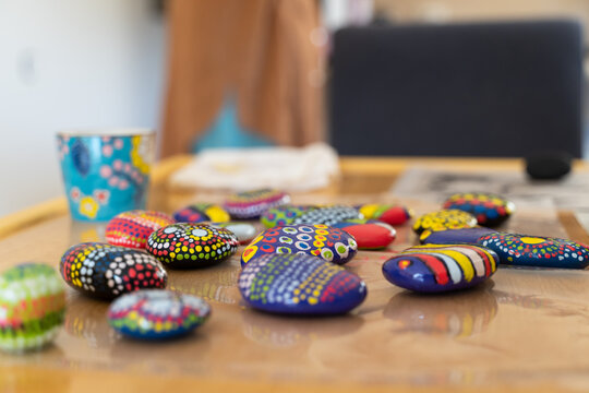 Close-up of painted mandala stones on table