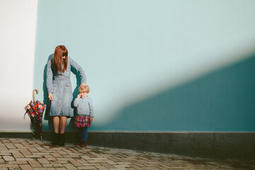 Mother walking with daughter in the city