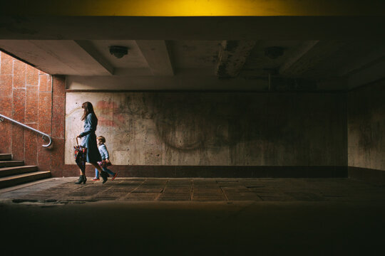 Mother walking with daughter in the city