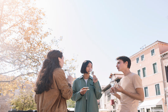 Young Adults Having An Aperitif Outdoors