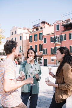 Young Adults Having An Aperitif In Venice