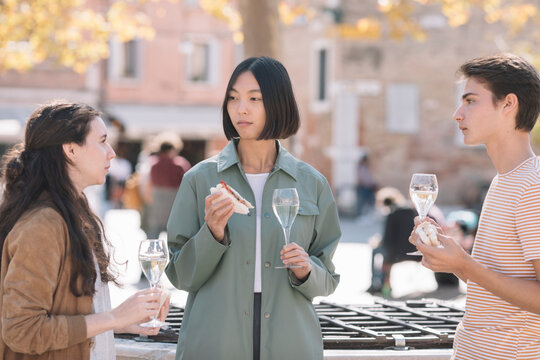 Young Adults Having An Aperitif Outdoors