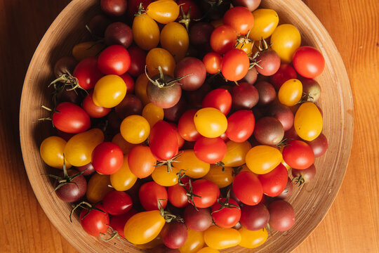 cherry tomatoes on the wooden desk