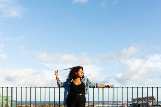 Latin woman on rooftop in Barcelona