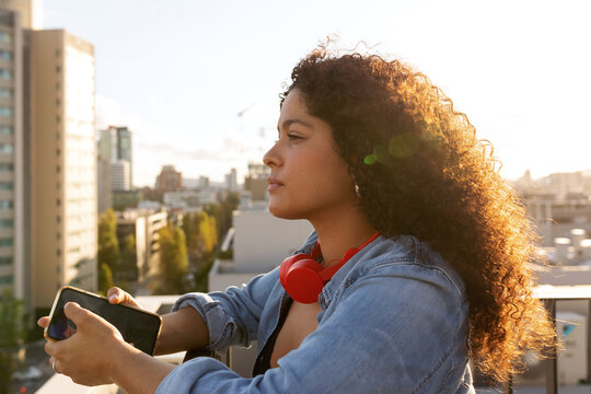 Pretty latin woman on rooftop