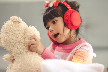 Happy holidays Cute little child opening present. The girl enjoyed the gift.