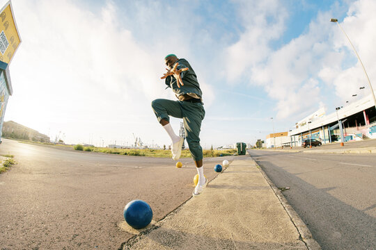 Cool black man reaching hand to camera on parking lot