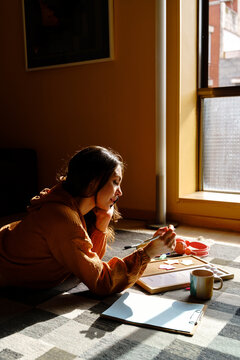Woman doing homework comfortably
