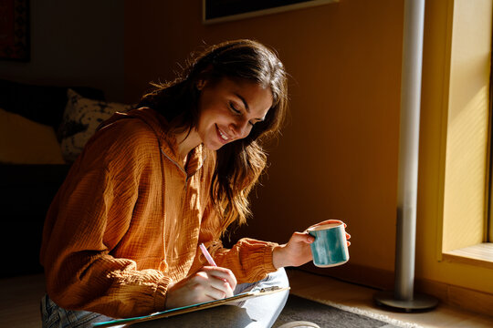 Woman writing in a notebook 
