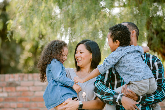 Joyful Mixed Race Family Outdoors