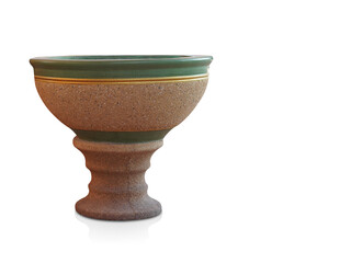 beautiful antique green and gold stone pot on brown stone saucer on white background, object, copy space