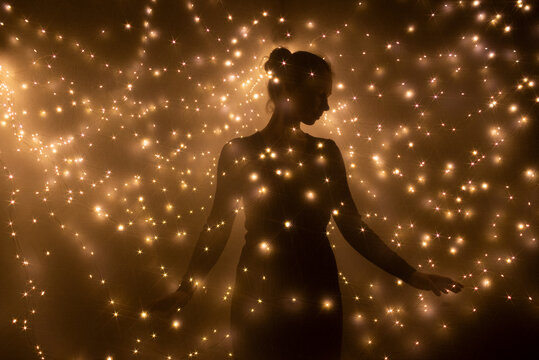 Woman surrounded with lights