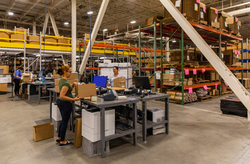 Warehouse workers at shipping station at cargo center