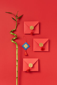 Red envelopes and bamboo twig