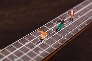 Skiers on the miniature creative strings