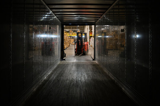 Man at  Loading loading dock  at warehouse forklift 