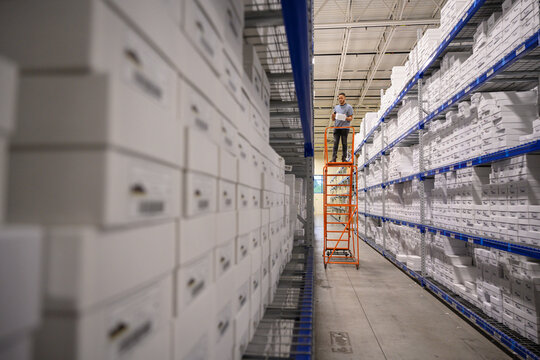 Scanning inventory at E-Commerce Warehouse 