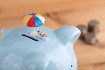 Miniature creative sun umbrella and easer at the mouth of the piggy bank