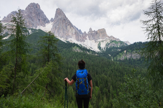 Female hiker looking at the mountains