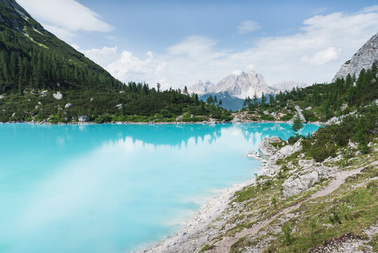 Turquoise lake with mountains in the background