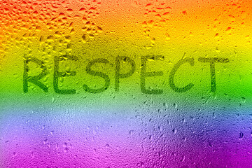 The inscription on the sweaty glass. The word RESPECT written on glass with rainbow
