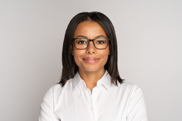 Portrait of successful african worker employee wearing glasses and happy smiling isolated over...