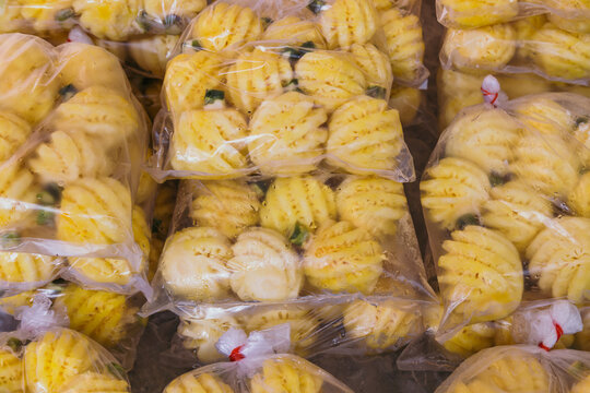 Pineapples in plastic bags