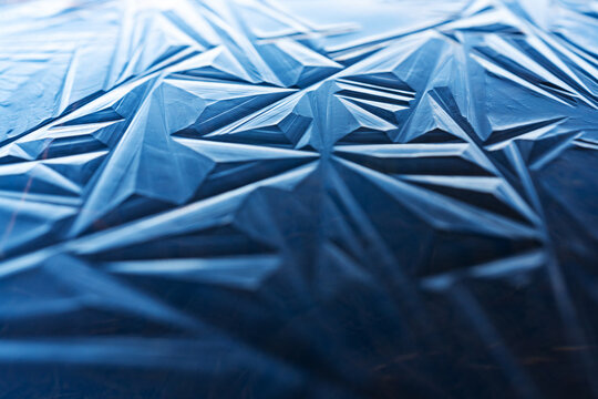 Blue ice shapes on a frozen pond