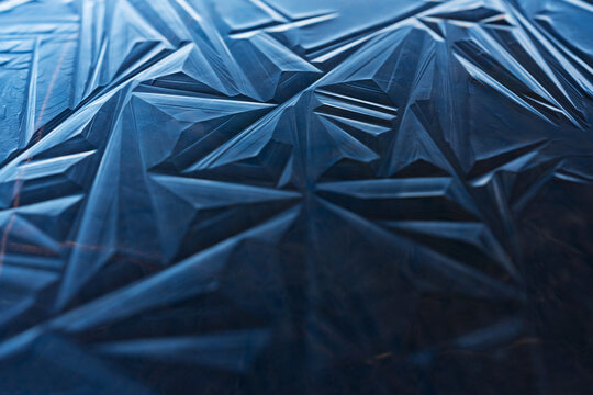 Blue ice shapes on a frozen pond
