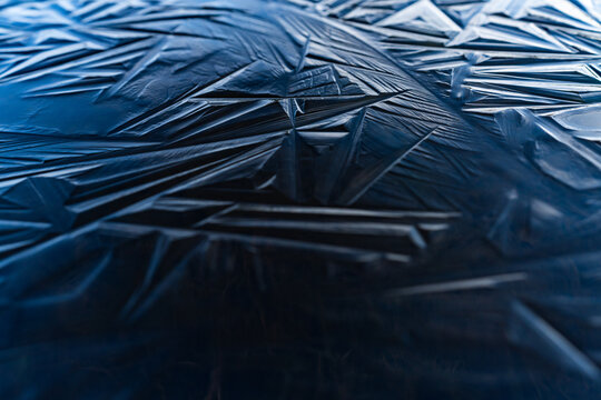 Blue ice shapes on a frozen pond