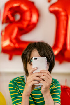 Faceless boy with smartphone