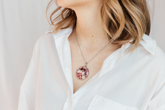 woman wearing floral epoxy necklace 