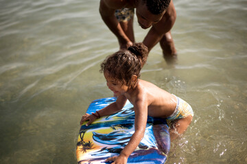 Toddler learning to swim