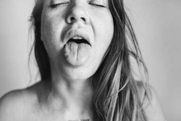 Woman sticking her tongue out