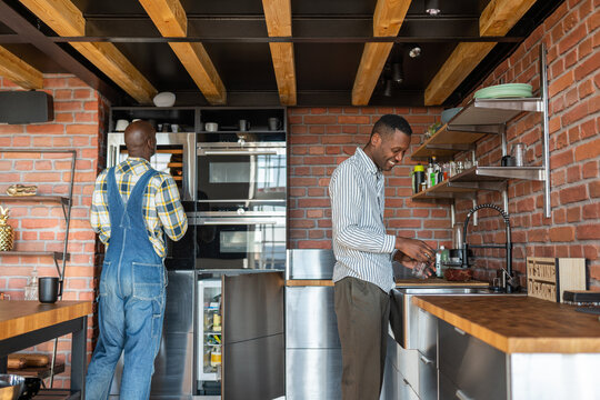 Couple Of Men At Kitchen