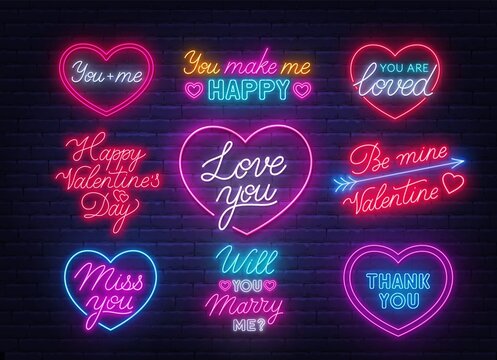 Happy Valentine's day neon quotes on brick wall background. Glowing Greeting Cards.
