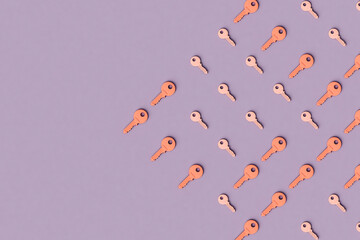 pink keys on violet background with copy space.